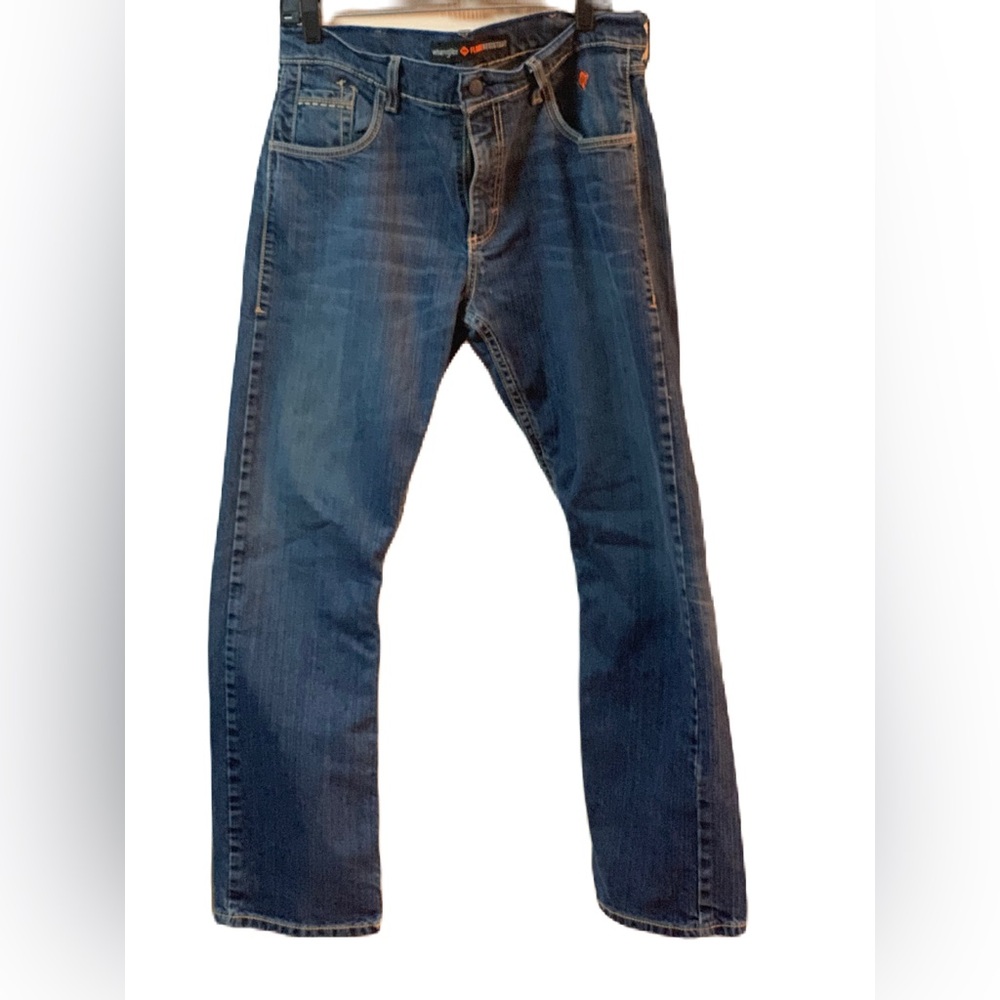 Wrangler FR Retro relaxed bootcut jeans in a medium-to-light wash. SZ 33X32